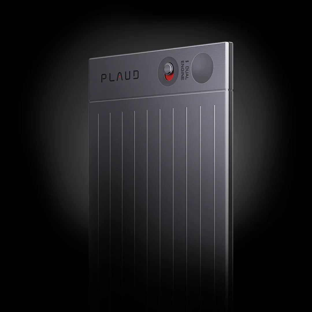 Card-shaped dark gray Plaud AI voice recorder with vertical ridges and a dual engine switch.