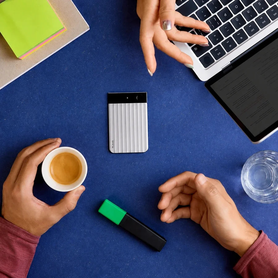 Plaud Note Pro on a table during a one-on-one conversation