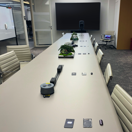 How far can you sit from your Plaud in a conference room?