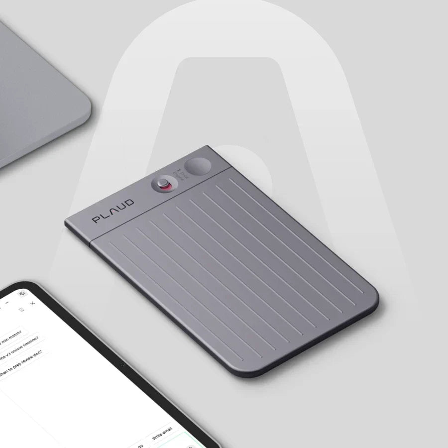 Plaud Note Pro device on a desk next to a laptop and tablet