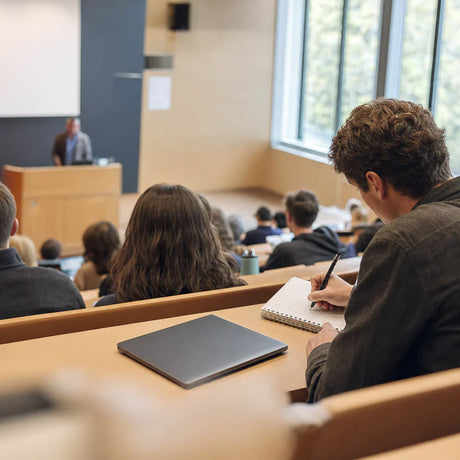 Plaud NotePin S clipped on a student in a lecture hall